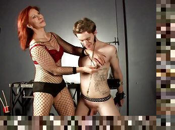 Bdsm enthusiast gets cruelly treated by red haired domina