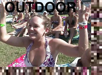 Outdoor reality clip with chicks wearing bikinis having fun at a party