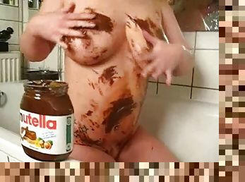 Busty amateur lesbians play with nutella in their bath