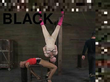 A black and a white chick going together through the hard torture