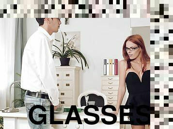 A hot redhead in glasses gets pounded by her boss at the office