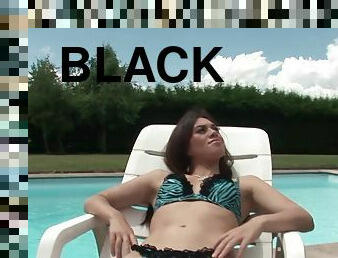 Tiffany Doll enjoys while sucking a big black cock by the pool