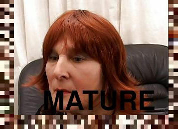 Mature woman with long red hair enjoying a hardcore doggy style fuck