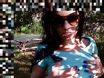 POV video of a babe in glasses giving a guy a blowjob outdoors