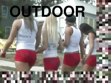 Attractive babes with long hair and hot bodies in shorts having fun in a wicked outdoor reality show