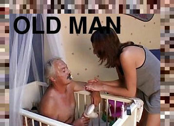 Sexy teen with long dark hair sucking an old man's cock