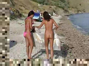 Lots of ladies naked at the beach and in water