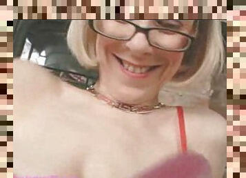 Mature blonde in glasses using dildos