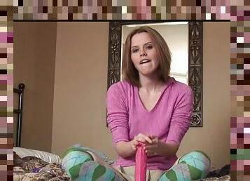 Pink sweater on naughty talking teen stroking dildo