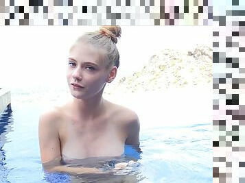 Blonde model Hannah takes a naked swim and posses afterwards