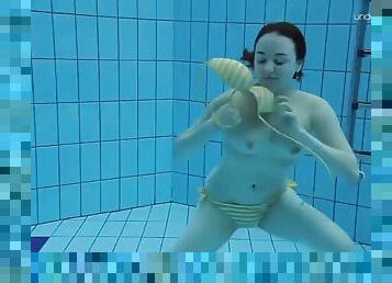 Teen Lada with small tits naked underwater