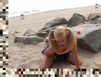 Petite teen masturbating on the beach