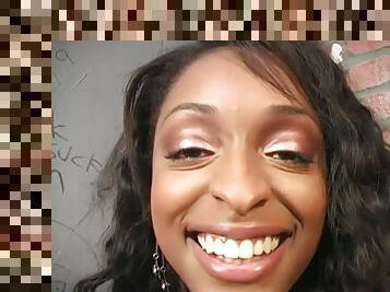 Busty ebony girl blows a cock in a gloryhole video