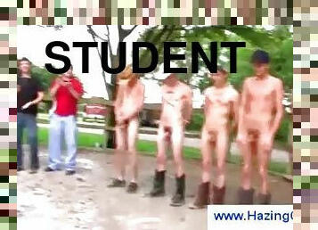 Naked students playing games outdoors