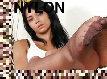 Sexy Felisja Fishball smoking while showing off her nylon-clad feet