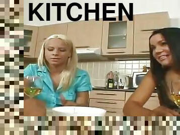 Two chicks get fucked on a kitchen table after taking a shower