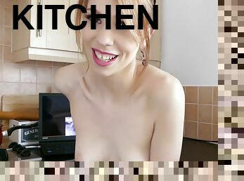 Redhead Babe Wanking Herself In The Kitchen While Watching Porn In Apron