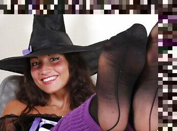 Gioia dressed as a sexy witch in black pantyhose