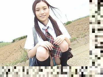 Japanese schoolgirl in knee highs flashes her panties