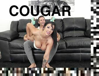 Stacked cougar shows off those huge tits while fucking a younger guy