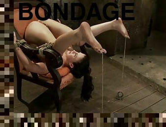 Tied up Cheyenne Jewel lies on an armchair and gets toyed