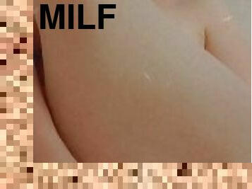 MILF using a big dildo in the shower ?