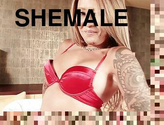 Tattooed transsexual in red fishnet ecstatic as she takes several shots