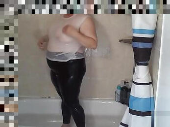 Shower In White Tank Top and Black Leggings