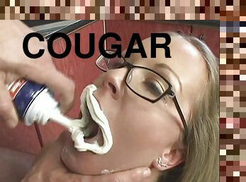 Blonde cougar with glasses getting her pussy licked in her kitchen