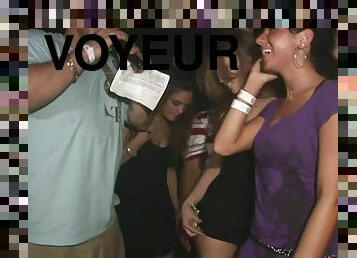 A few slutty chicks flash their butts in a club in voyeur video