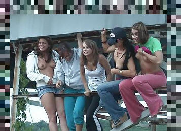 Randy teens on water ride enjoys stripping and displays ass and tits