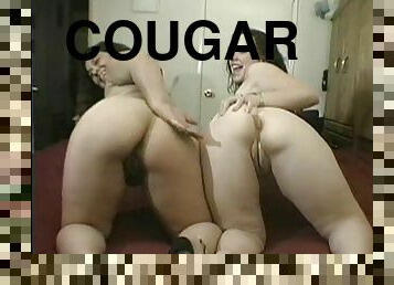 Chubby cougar with long dark hair enjoying a hardcore foursome
