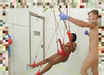 Bound Ebony Submissive Hanging From Ceiling