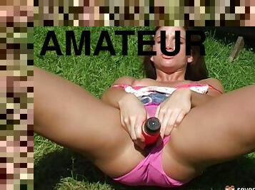 Village beauty masturbates on the grass in front of her house