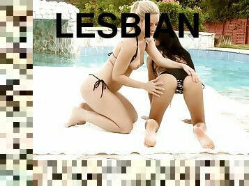 Having lesbian sex by the pool on a hot summer day