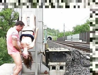 Exhibitionist in fishnets gets fucked by the railroad