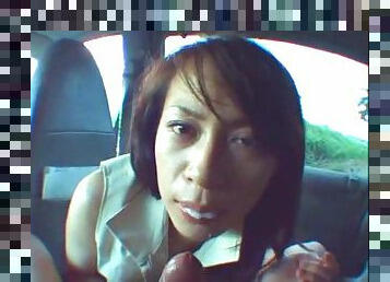 Adorable Asian vixen gives head in the car in a pov clip