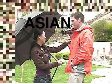He takes the camera from the Asian girl and convinces her to suck dick