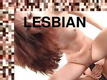 Two slim brown-haired lesbians share a big dildo in hardcore clip