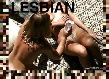 Kinky lesbian with natural tits enjoys getting oiled then fucked outdoors