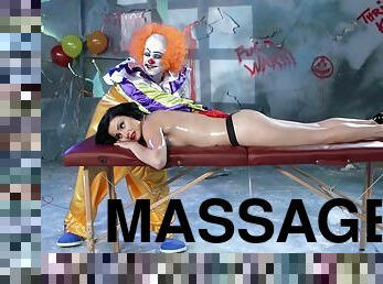 A creepy clown gives this girl a massage then fucks her