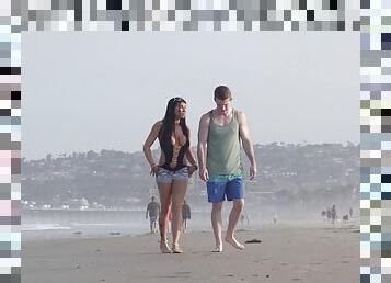 Young couple takes a walk on the beach and stops for a outdoor fuck