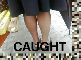 Girl with beautiful legs gets caught on a voyeur's cam in the street