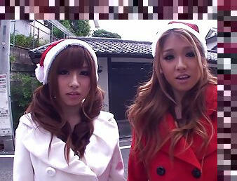 Two depraved Japanese Santa girls ride a shaft by turns in FFM reality