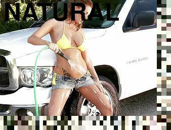 Sheila Grant wearing a bikini washes a car and her big natural tits