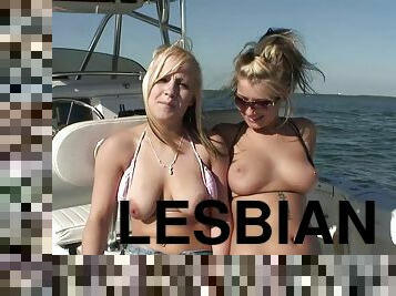 Curvy lesbian amateurs with piercing  in bikinis have outdoor fun on a yacht