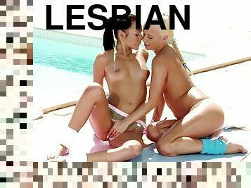Sunbathing beauties have some lesbian fun by the pool