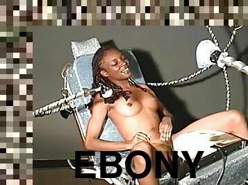 Slim ebony chick gets her hairy pussy toyed by a machine