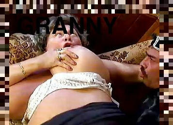 Huge-breasted granny Naomi sucks a prick before jumping on it
