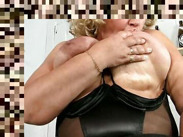 Blonde granny Grace licks her big tits and fingers her meaty cunt